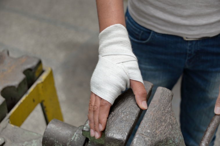 african american man hand wrapped hand from burn injury