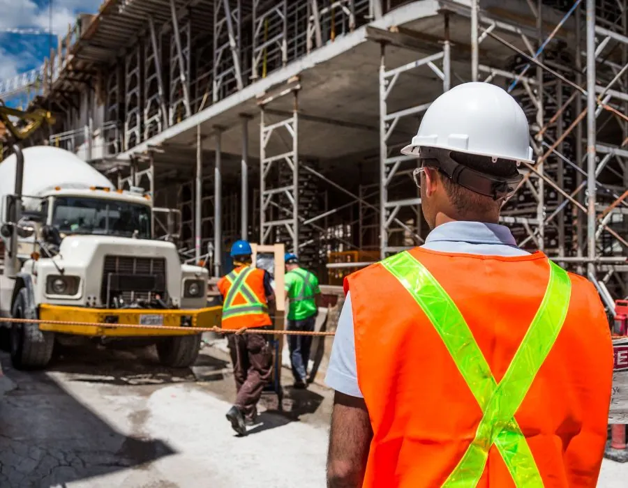 man in charge of construction site leading his crew on build