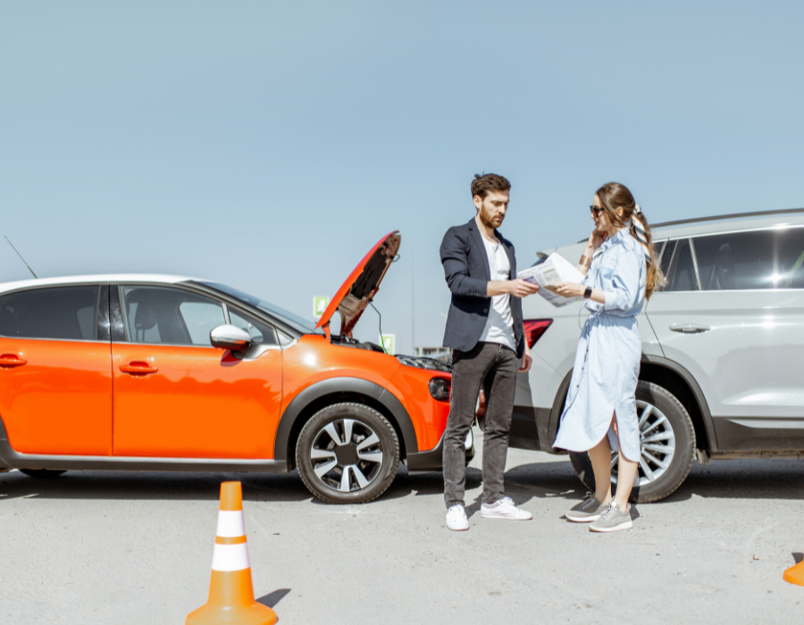 rental car wreck with orange and grey suv